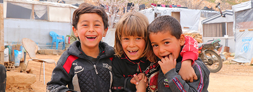 Refugee children smiles and luaghes